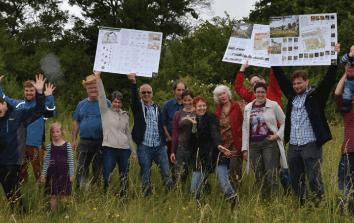 Photo of members of Cambridge Cohousing standing on the K1 site