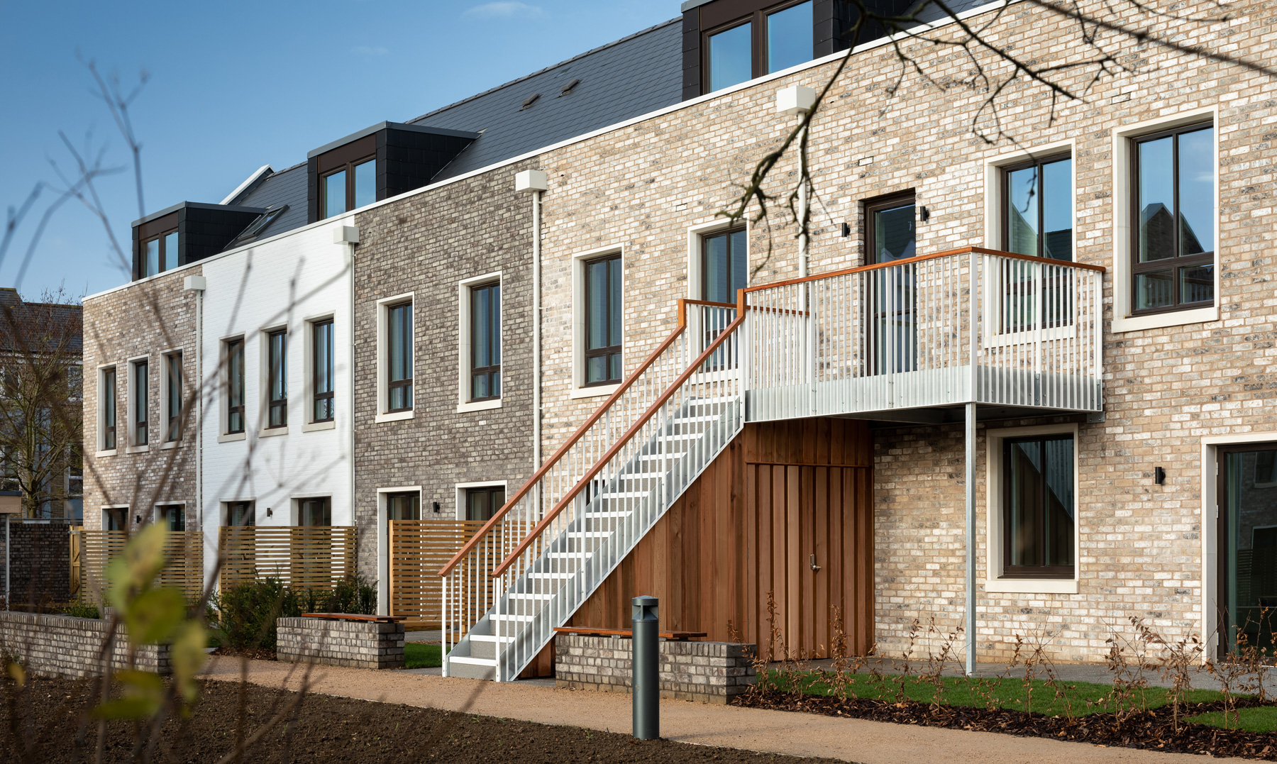 Terrace of houses at Marmalade Lane showing different brick treatments